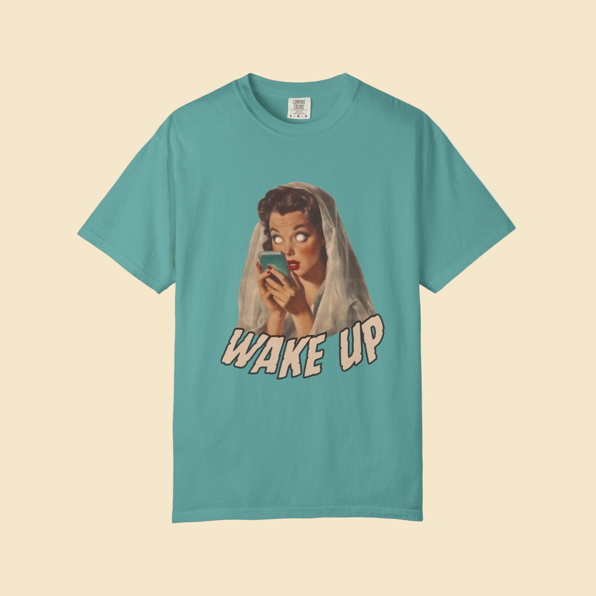 Teal t-shirt with graphic design and 'Wake Up' text on a white background