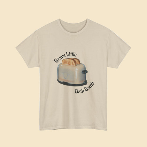Beige t-shirt with a graphic of a toaster and text 'Brave Little Bath Bomb' on a white background