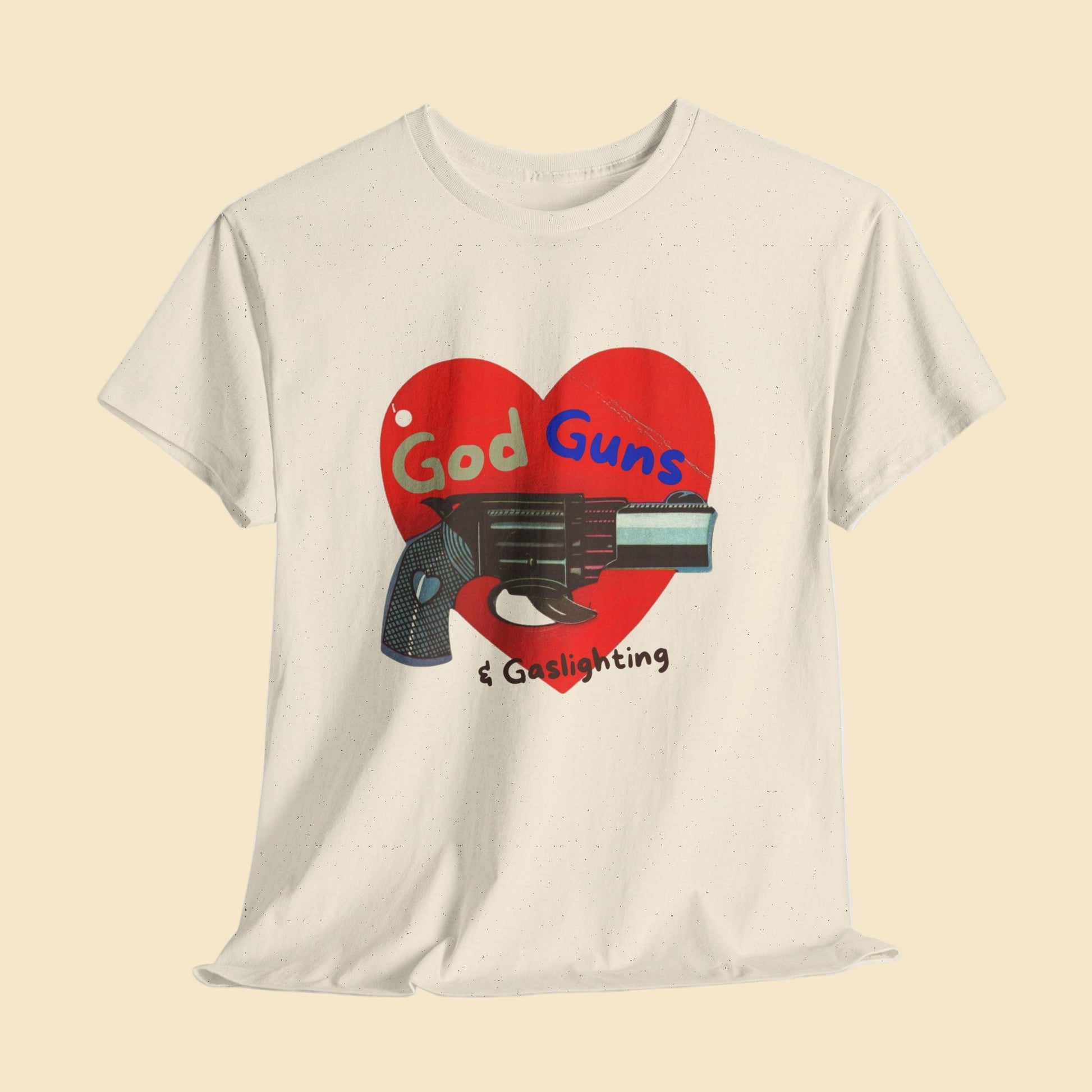Beige t-shirt with a graphic design of a heart, gun, and text on a white background