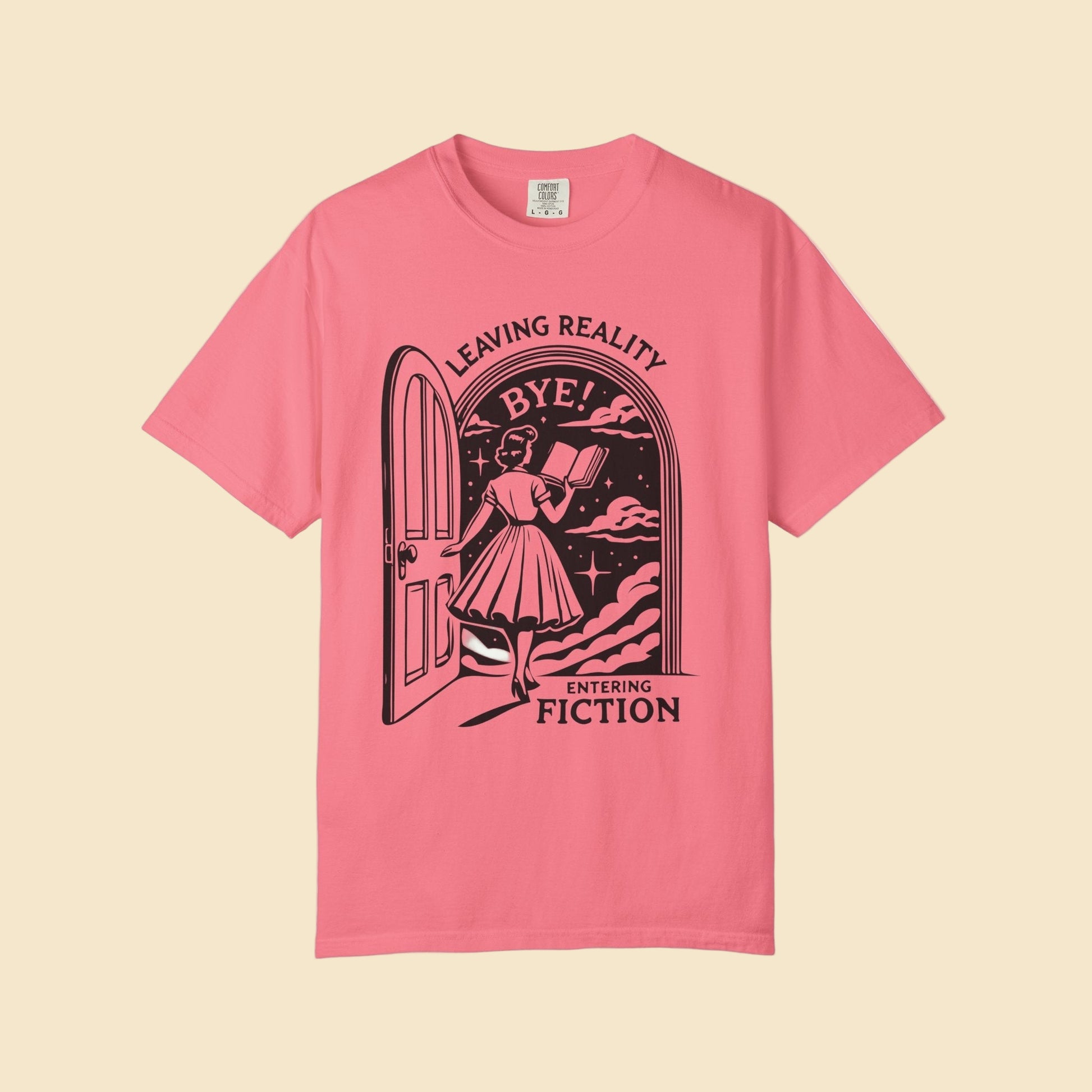 Pink t-shirt with black graphic design and text on a white background