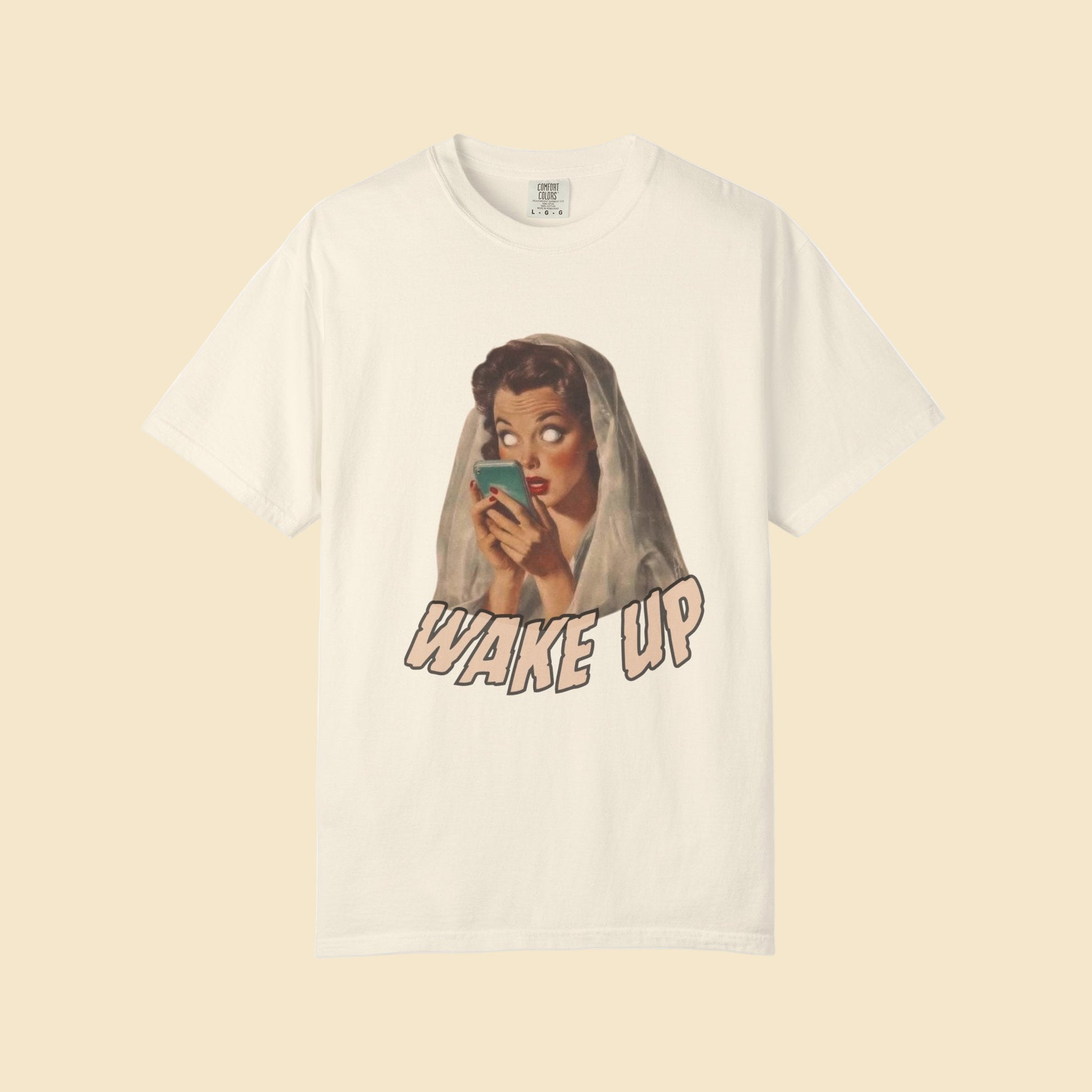 Beige t-shirt with graphic design of a woman and 'Wake Up' text on a white background