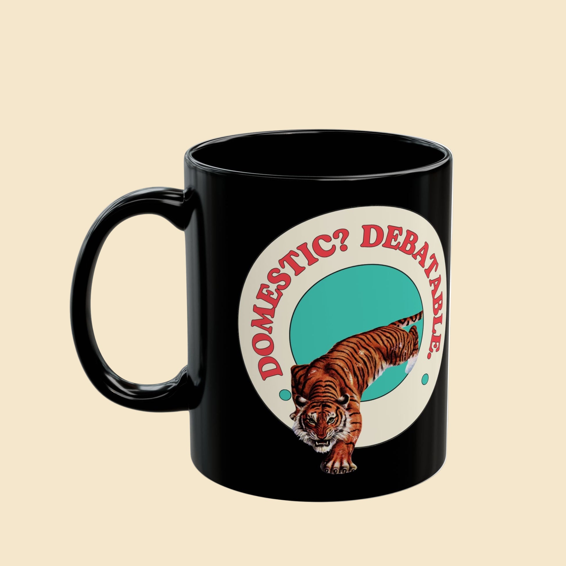 Black mug with a tiger graphic and text 'DOMESTIC? DEBATABL' on a white background